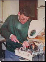 Edward Fisher at work hand turning a piece of Blue John